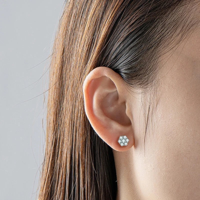 Bee-Bees round moissanite stud earrings in white gold, featuring a floral cluster design with D Color VVS1 stones.