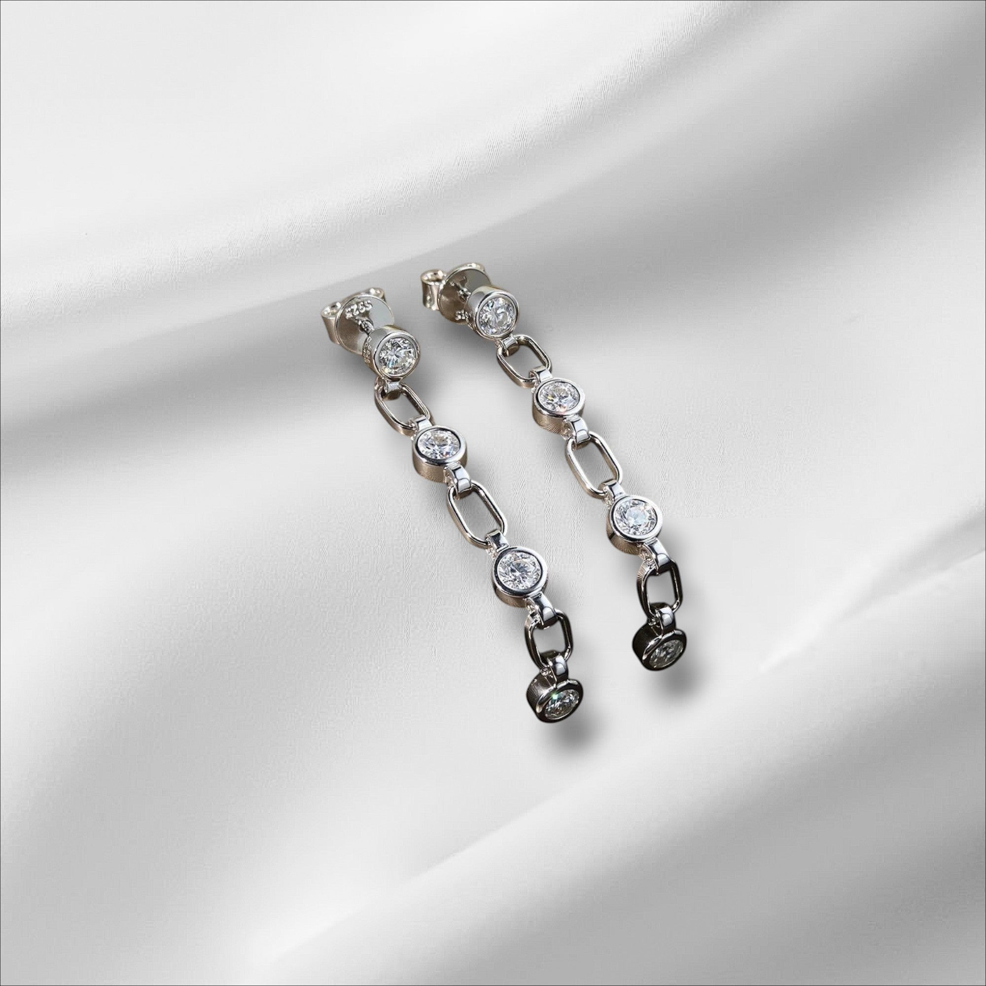 Bee-Bee's S925 silver chain tassel earrings with 3mm moissanite stones. Dainty, elegant, and perfect for special occasions.