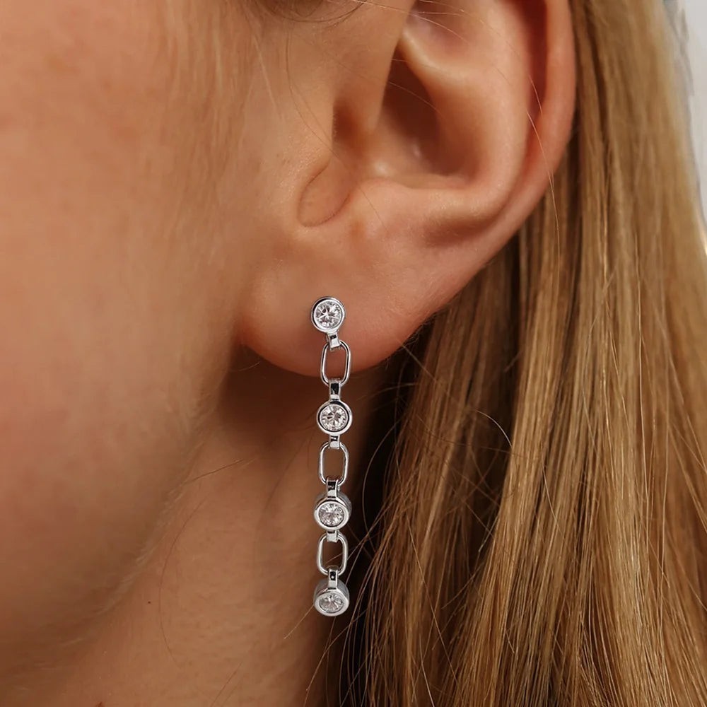 Bee-Bee's dainty sterling silver chain drop earrings with four round moissanite stones.