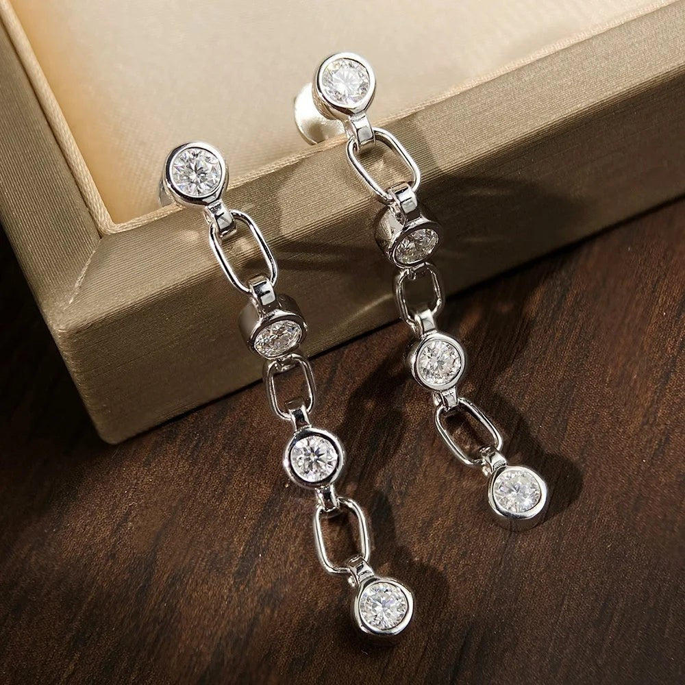 Bee-Bee's dainty S925 silver chain tassel earrings with round brilliant moissanite stones.