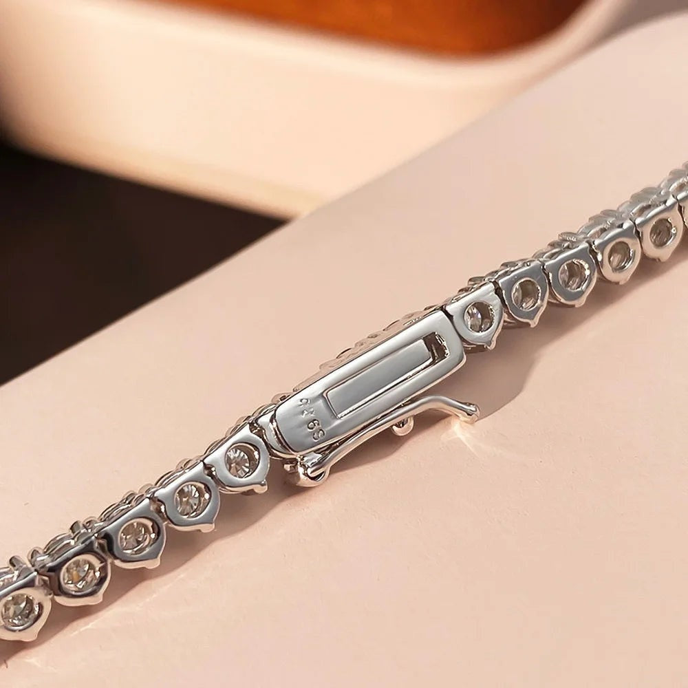 Bee-Bees silver tennis necklace with 4ct pear-cut moissanite and VVS1 clarity.