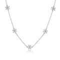 Bee-Bee's sterling silver necklace with five flower-shaped moissanite charms. Dainty, elegant, and sparkling.
