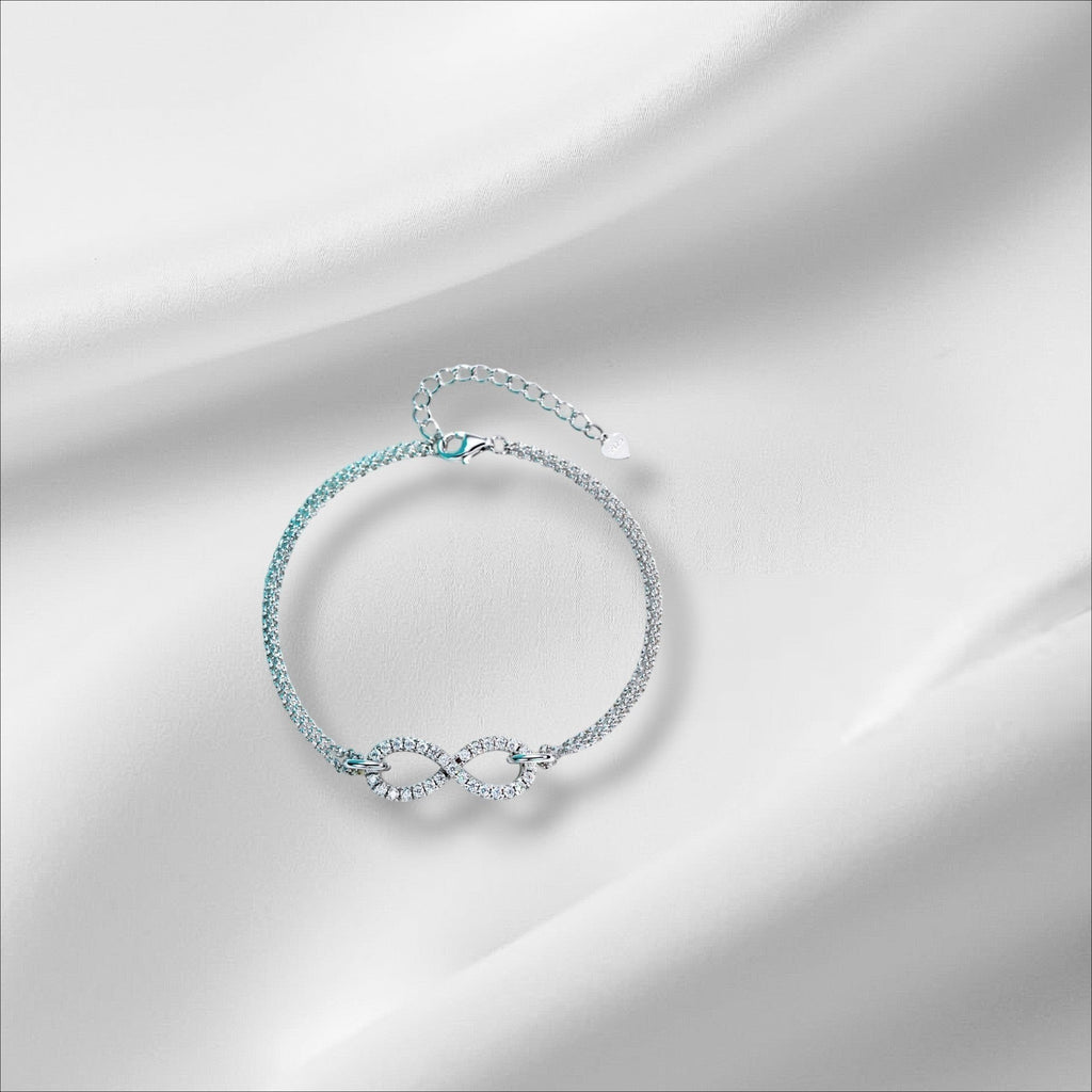 Bee-Bees sterling silver bracelet with infinity symbol adorned with moissanite stones, 18k gold plated, adjustable chain.