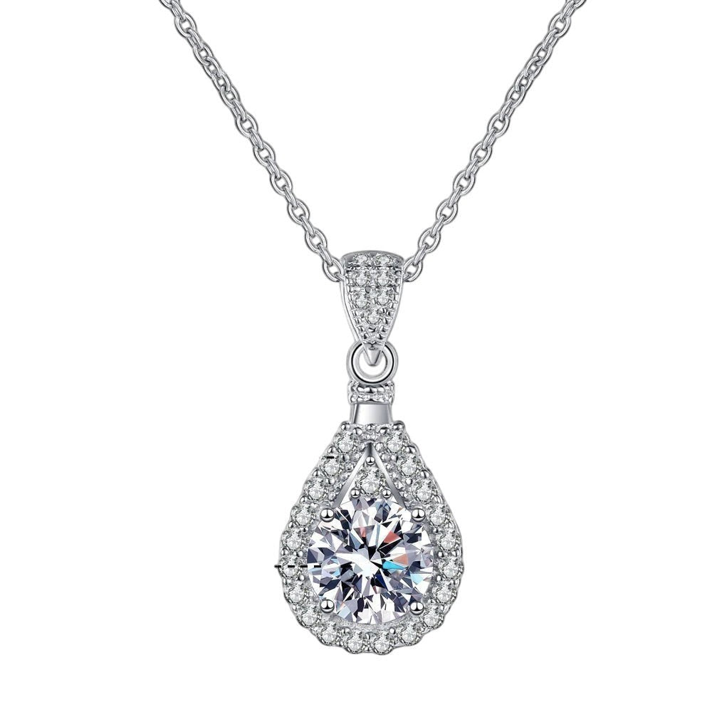 Bee-Bees teardrop pendant necklace with a D color VVS1 moissanite center stone and halo of zircon, crafted in 925 sterling silver.
