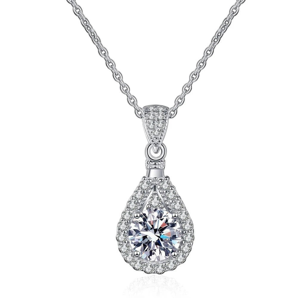 Bee-Bees teardrop pendant necklace with a D Color VVS1 moissanite surrounded by small stones, set in 925 sterling silver.
