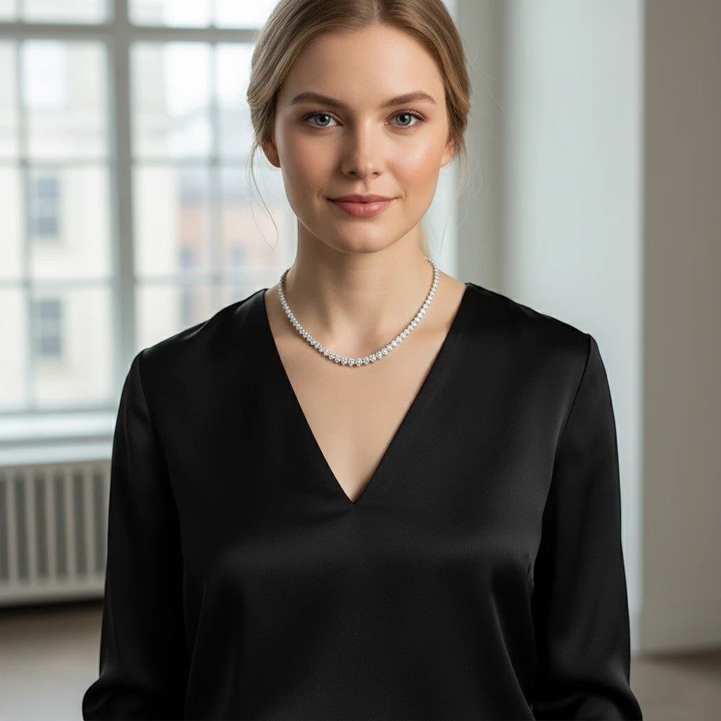 Bee-Bee's 18k white gold plated silver triple-claw moissanite tennis necklace with round cut stones.