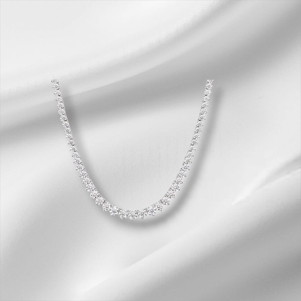 Bee-Bee's 18k white gold plated silver triple-claw moissanite tennis necklace with round-cut stones.