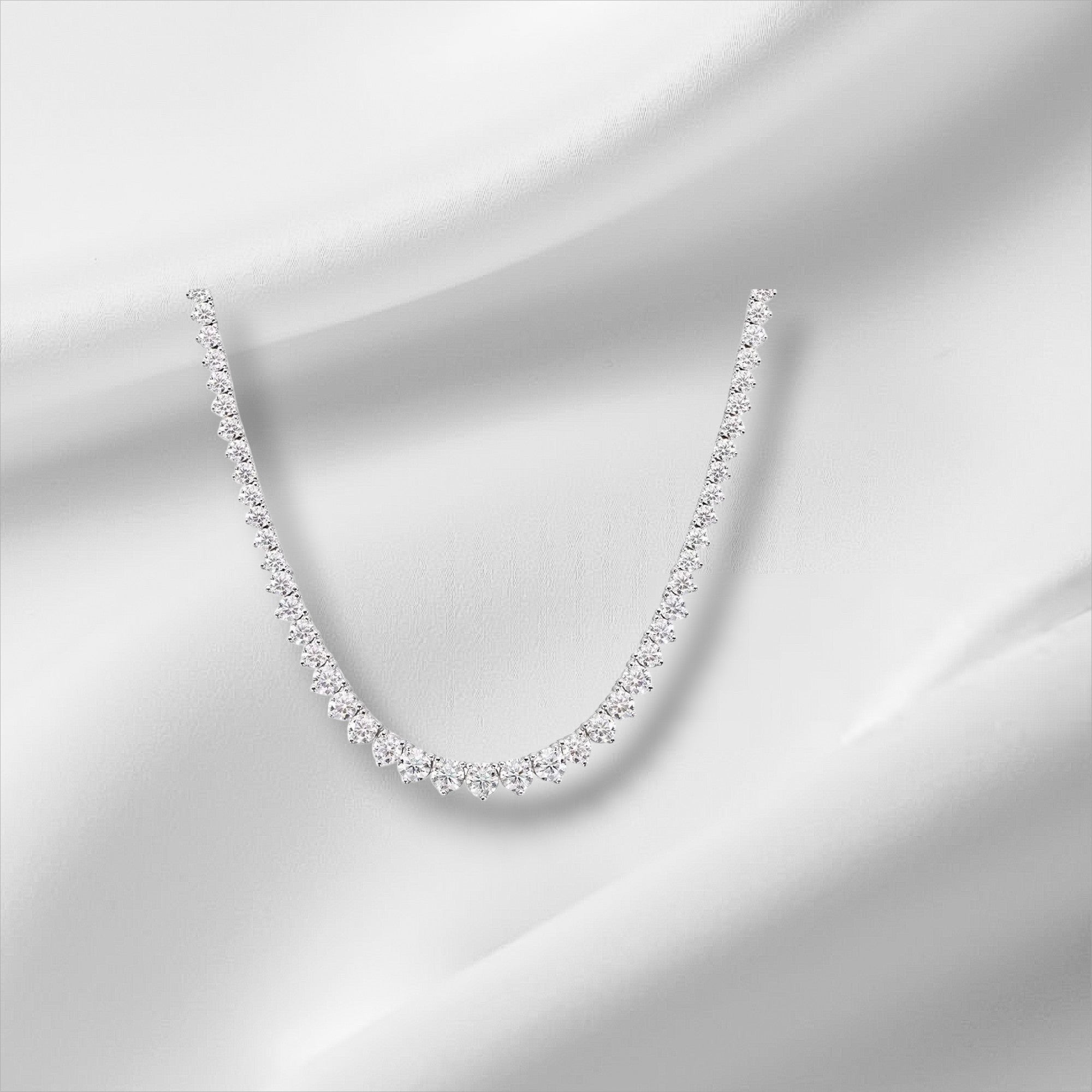 Bee-Bee's 18k white gold plated silver triple-claw moissanite tennis necklace with round-cut stones.