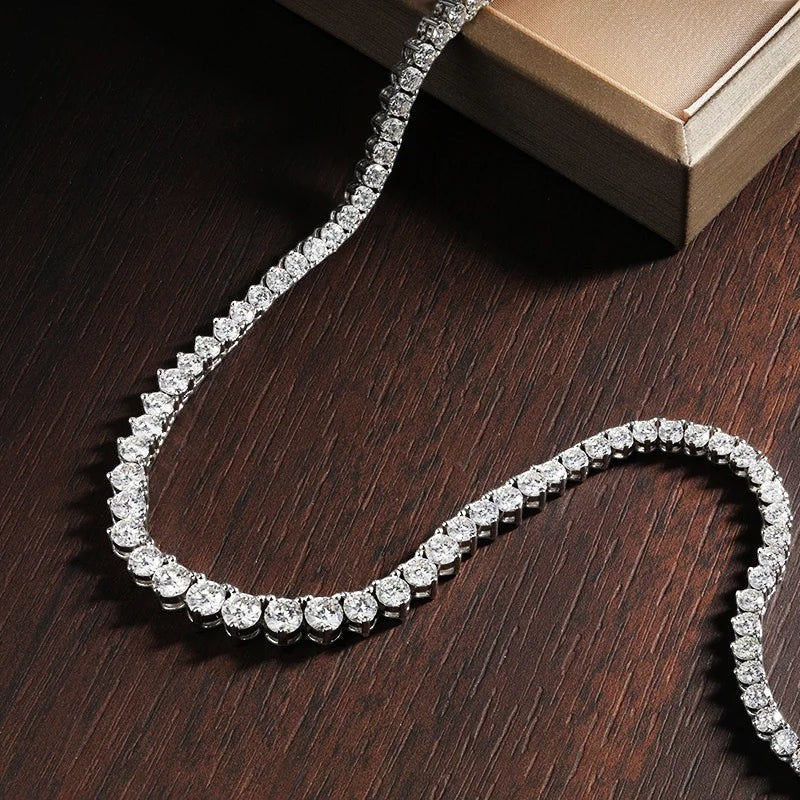 Bee-Bee's 18k white gold plated silver triple-claw tennis necklace with round moissanite stones.