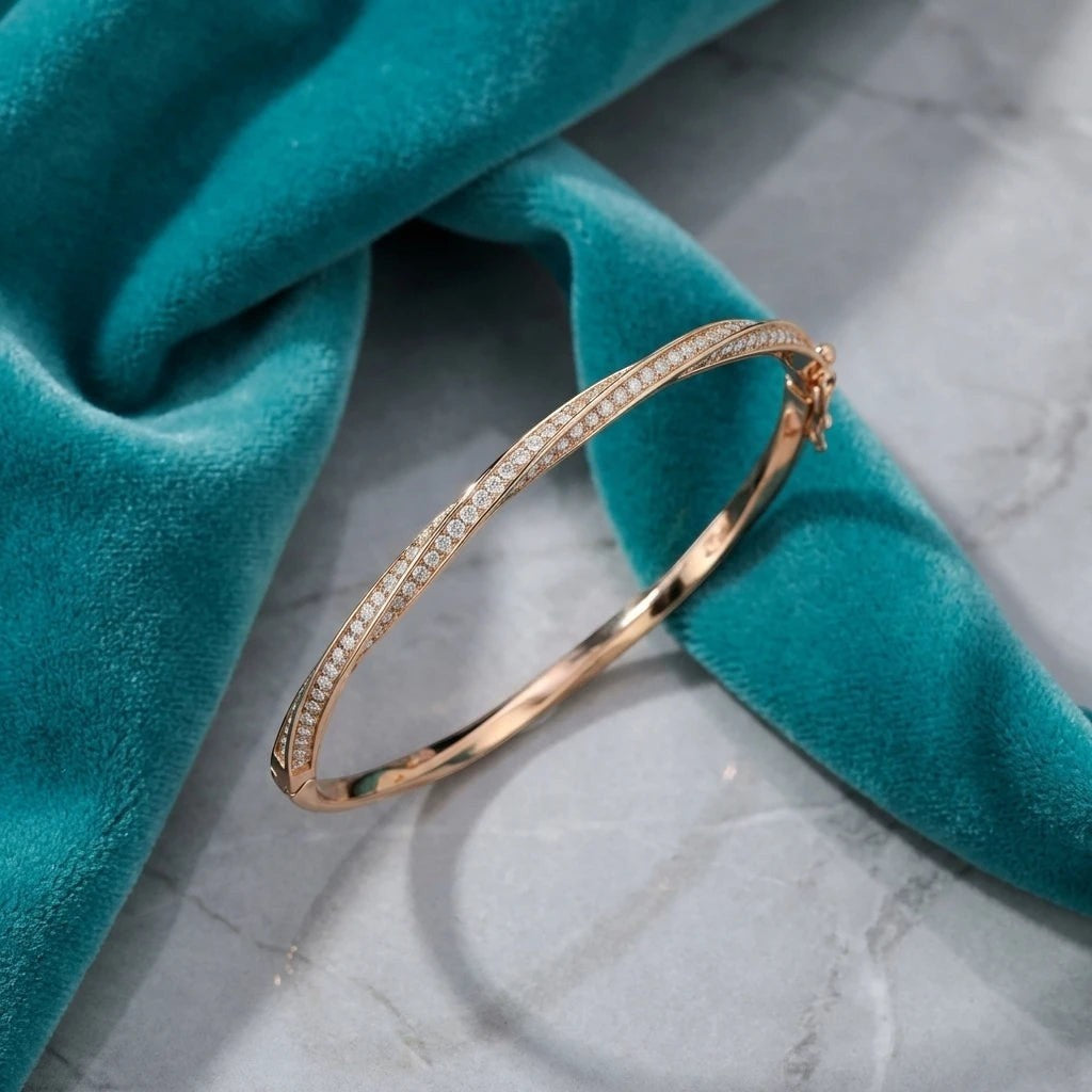 Bee-Bees rose gold twisted bangle bracelet with D VVS1 moissanite stones and a hidden clasp.