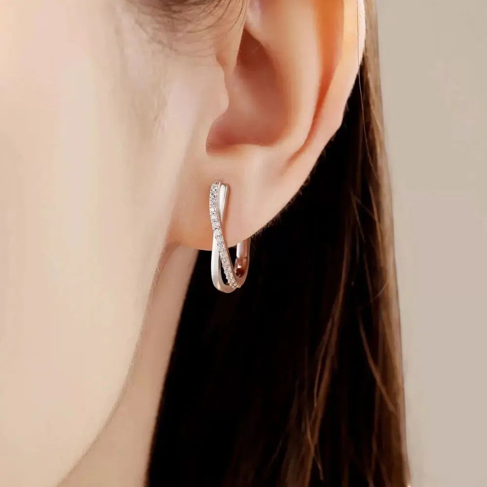 Bee-Bees sterling silver twisted hoop earrings with pavé-set D Color VVS1 moissanite stones.