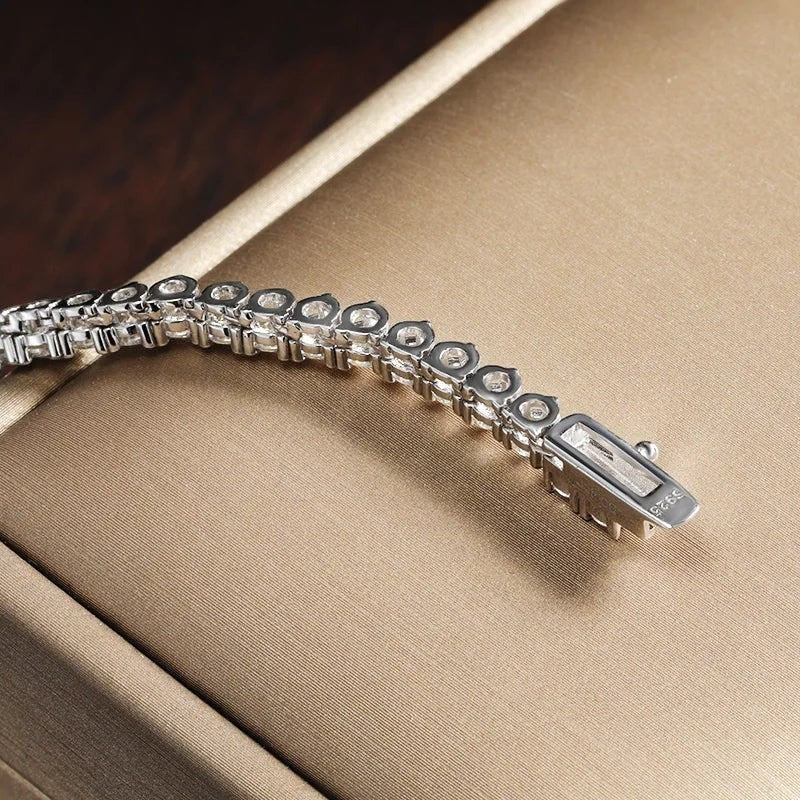 Bee-Bee's 18k white gold plated silver triple-claw moissanite tennis necklace with round-cut stones and secure clasp.